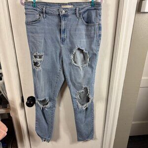 Levi's 721 High Rise Skinny Jeans. Light wash distressed with holes